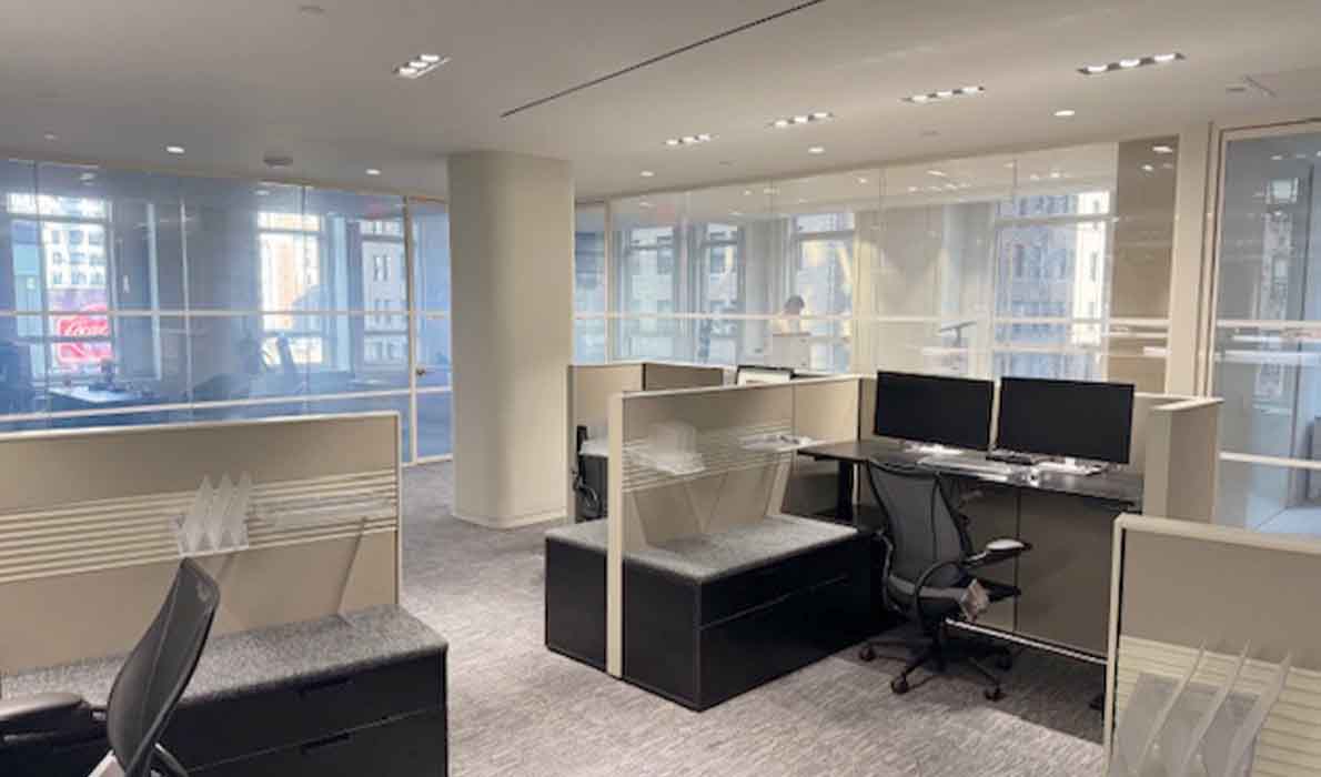 Modern NYC office renovation completed by Universal Manamagement, showcasing professional commercial interior construction and glass partition design.